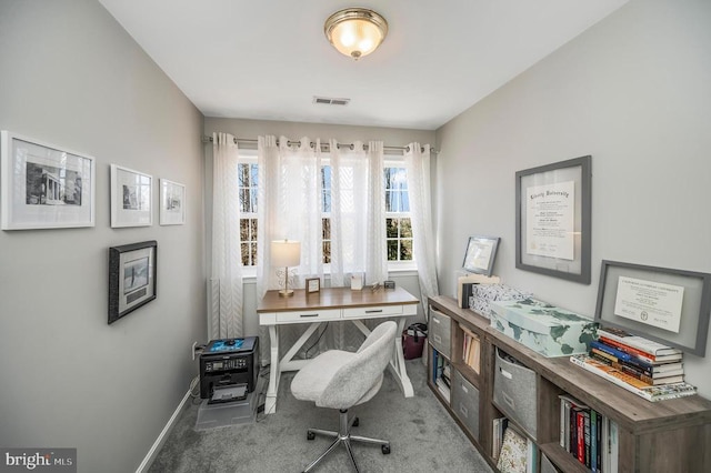 carpeted home office featuring baseboards and visible vents