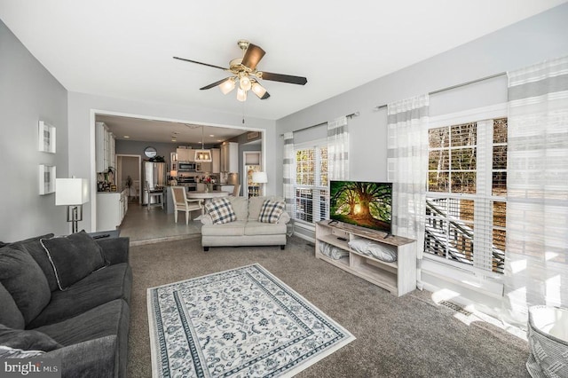 living room featuring a ceiling fan