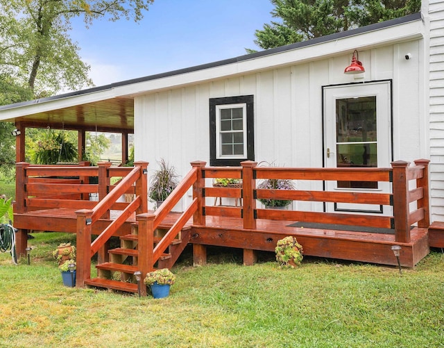 wooden deck featuring a lawn