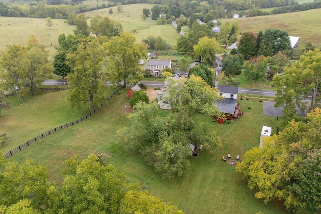 birds eye view of property with a rural view