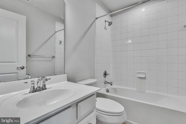 bathroom with toilet, bathing tub / shower combination, and vanity