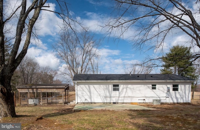 exterior space featuring central air condition unit, a yard, and a patio