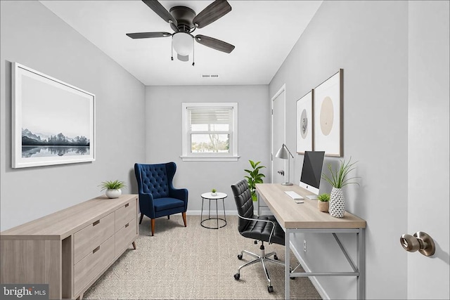 home office with baseboards, visible vents, and a ceiling fan