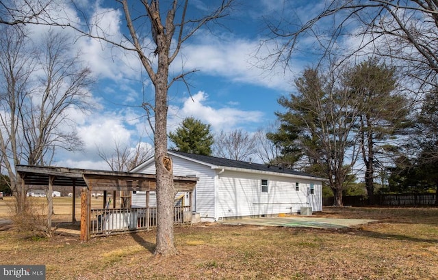 rear view of house with a lawn