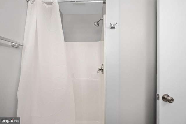 bathroom with a shower with shower curtain