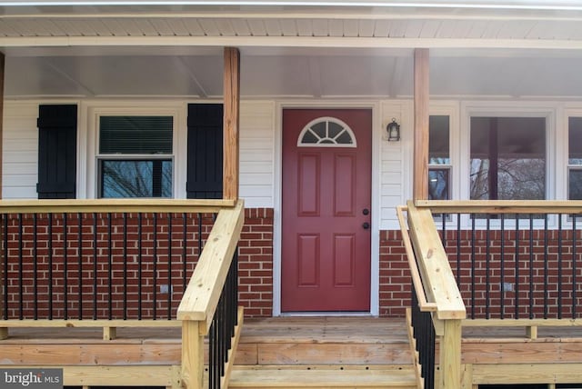 property entrance with brick siding