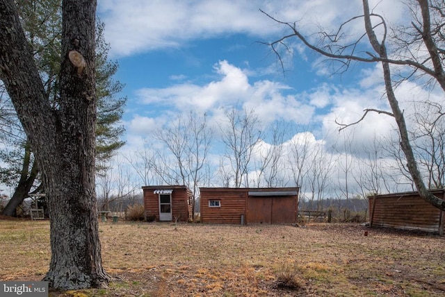 exterior space featuring an outbuilding