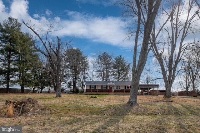 single story home with a wooden deck