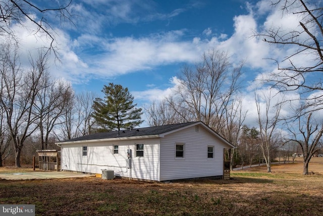 rear view of house with central AC