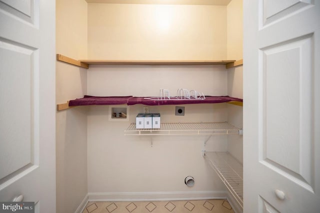 laundry room with hookup for a washing machine and hookup for an electric dryer