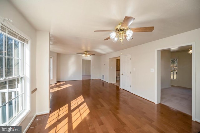 unfurnished room with hardwood / wood-style floors and ceiling fan