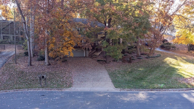 view of front of house with a garage and a front yard