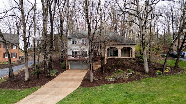 view of front facade with a garage and a front lawn