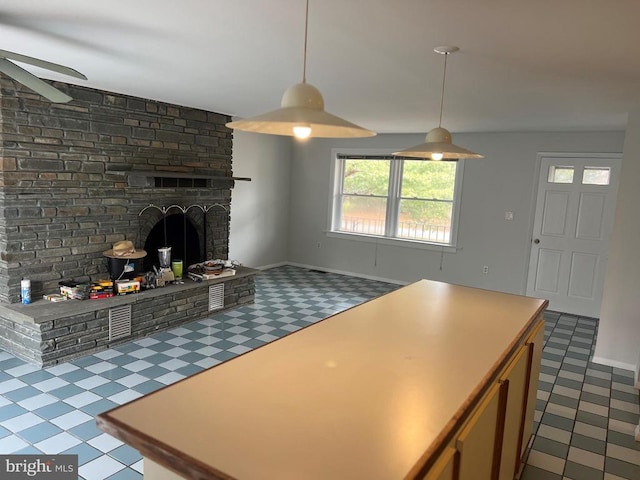 kitchen featuring a large fireplace