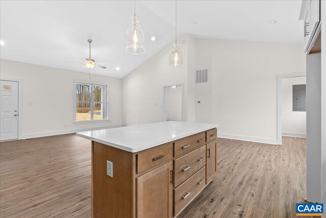 kitchen featuring pendant lighting, high vaulted ceiling, ceiling fan, and light wood-type flooring