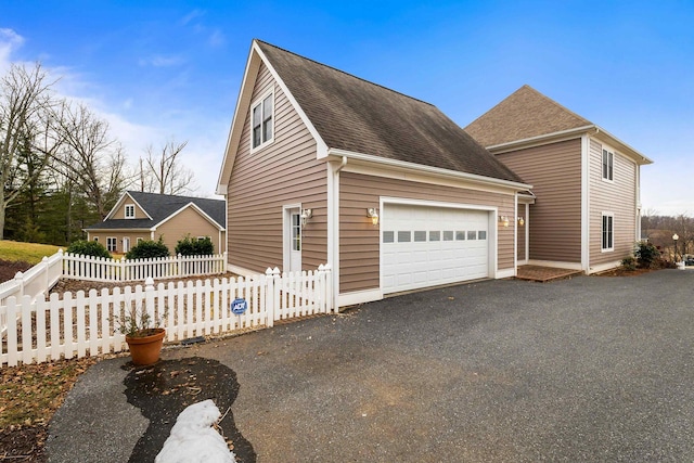 view of property exterior with a garage