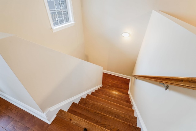 stairway featuring hardwood / wood-style flooring