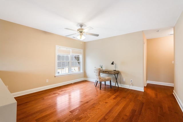 empty room with dark wood-type flooring and ceiling fan