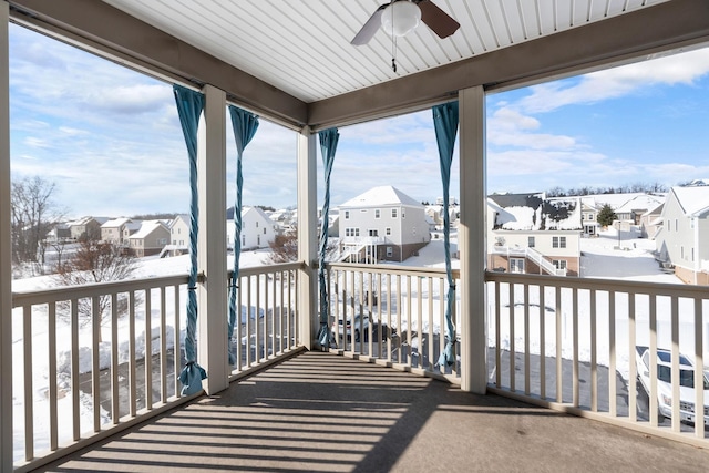 exterior space featuring a residential view and ceiling fan