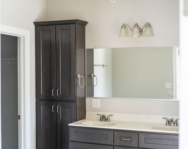 bathroom featuring double vanity and a sink