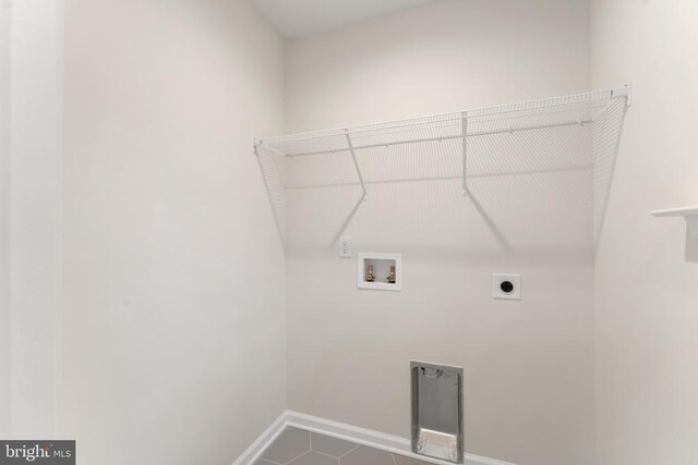 laundry room with washer hookup, tile patterned floors, and hookup for an electric dryer