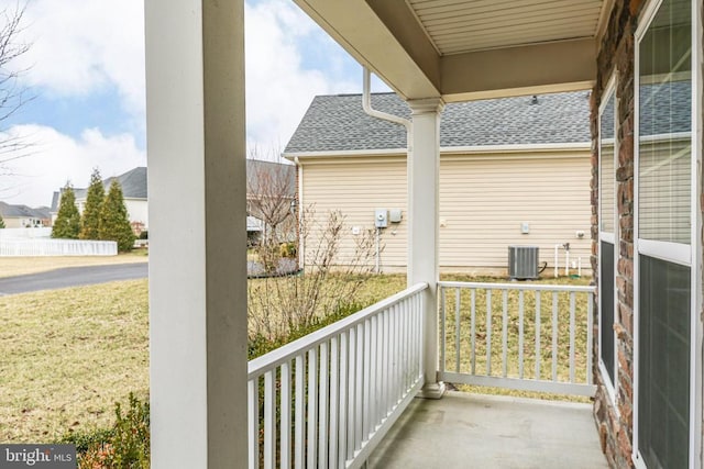 balcony featuring central AC unit and covered porch