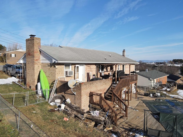 back of property featuring cooling unit and a deck