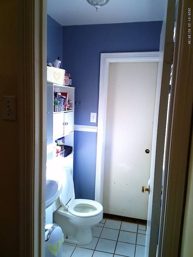 bathroom with tile patterned floors and toilet