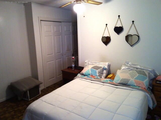 bedroom featuring ceiling fan and a closet