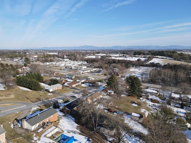 snowy aerial view with a mountain view