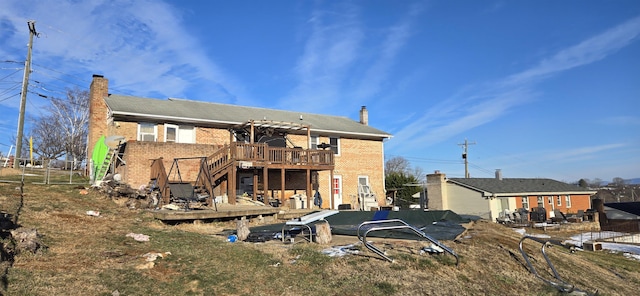 rear view of property with a deck