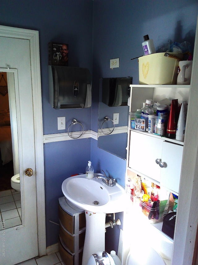 bathroom featuring tile patterned flooring and sink