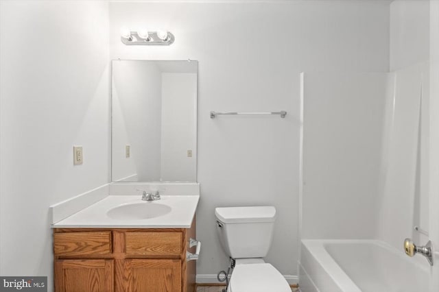 full bathroom with toilet and vanity