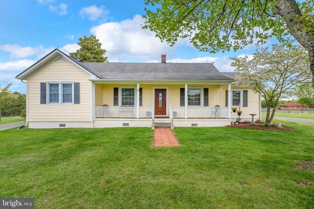 ranch-style home with crawl space, a chimney, covered porch, and a front lawn