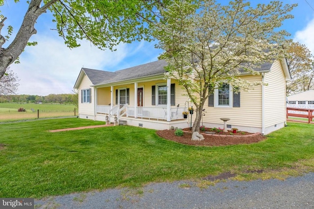 single story home with crawl space, a porch, a front yard, and fence