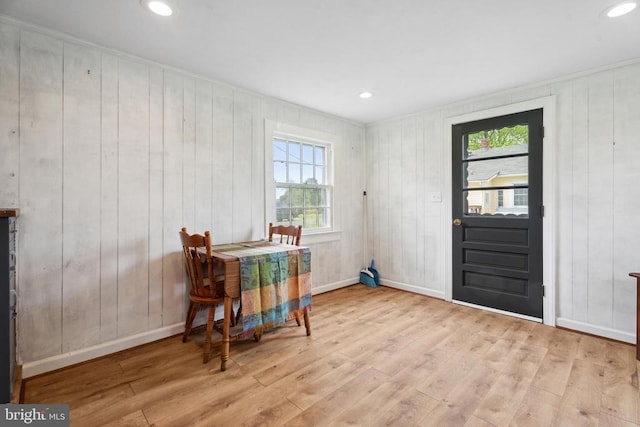 dining space with recessed lighting, baseboards, and wood finished floors