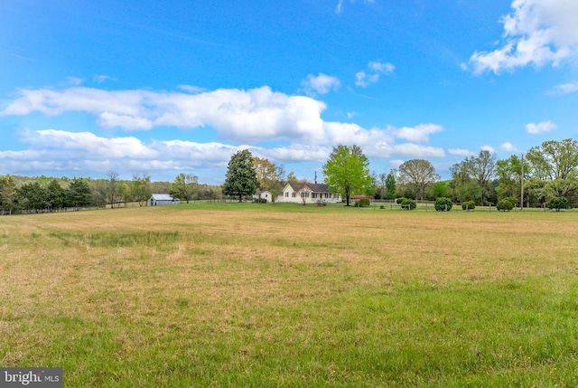 view of yard with a rural view