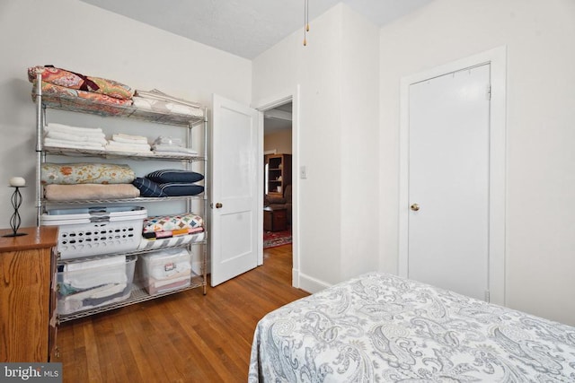 bedroom featuring wood finished floors