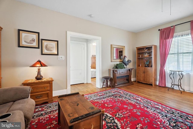 living room with wood finished floors and baseboards