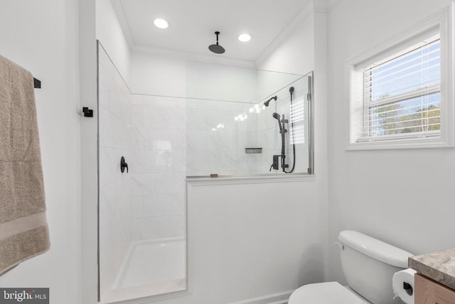 bathroom with walk in shower, toilet, ornamental molding, and vanity