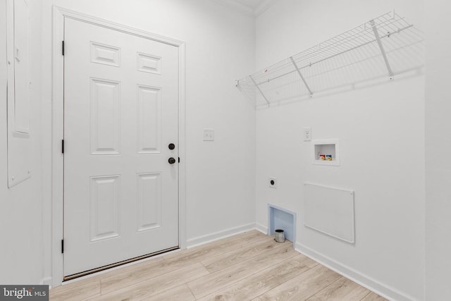 clothes washing area with light wood-style flooring, electric dryer hookup, baseboards, hookup for a washing machine, and laundry area