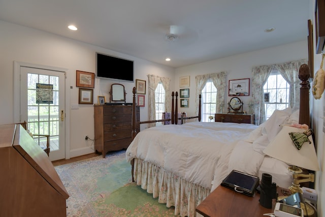 bedroom featuring baseboards, access to outside, wood finished floors, and recessed lighting