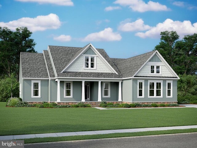 view of front of home featuring a front yard and covered porch