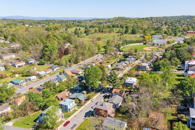 birds eye view of property with a residential view and a forest view