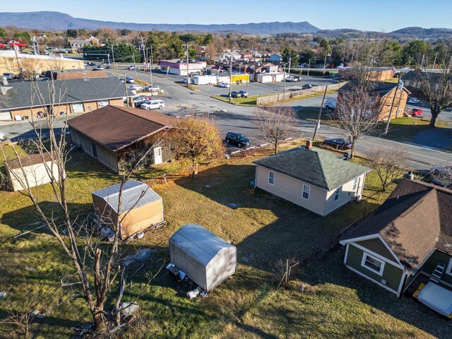 birds eye view of property with a mountain view