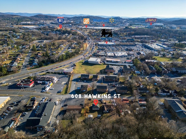 birds eye view of property with a mountain view