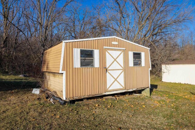 view of outdoor structure with a lawn