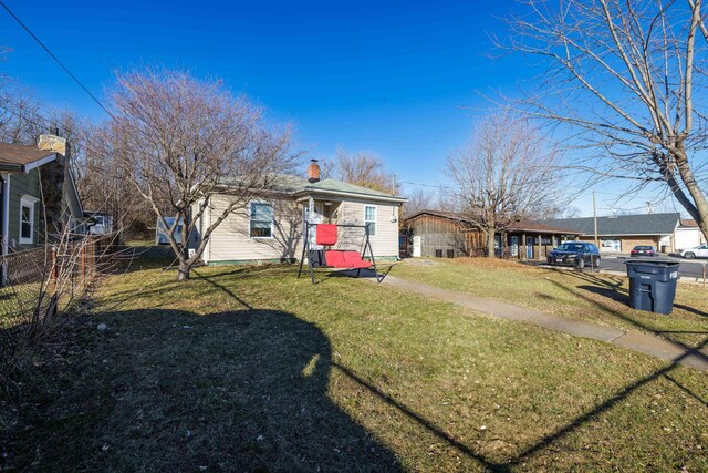 exterior space featuring a front lawn