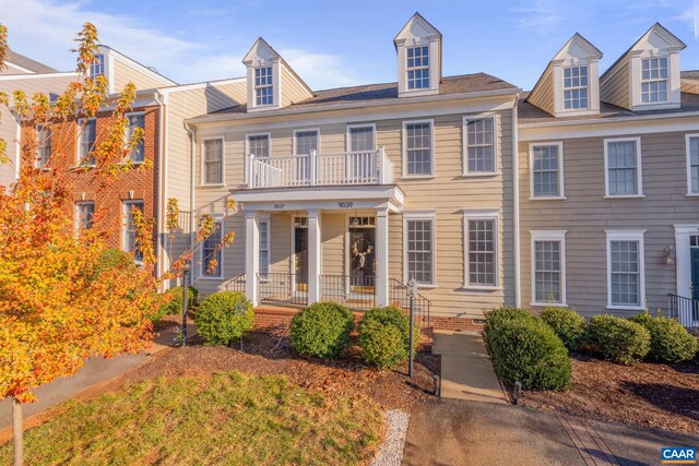 view of front of house with a balcony