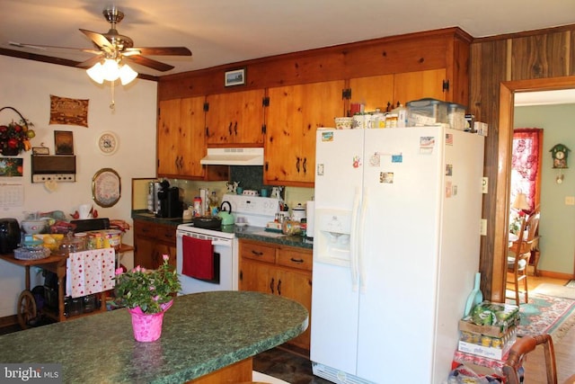 kitchen with white appliances, decorative backsplash, and ceiling fan